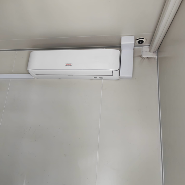 Inside the container showing the fan and informational posters